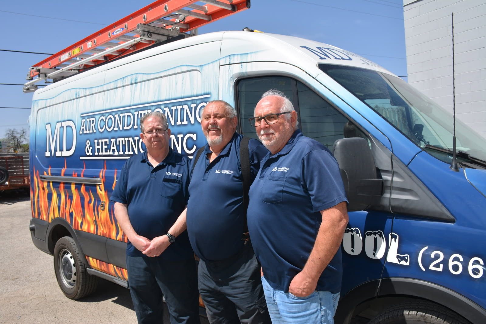 MD Air Conditioning & Heating team in front of company van